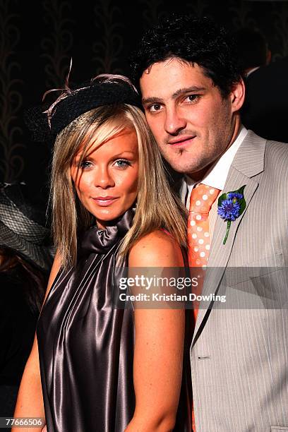 Carlton FC player Brendan Fevola and wife Alex pose together at the Andrew McManus Marquee on the first day of the Melbourne Cup Carnival, Derby Day,...