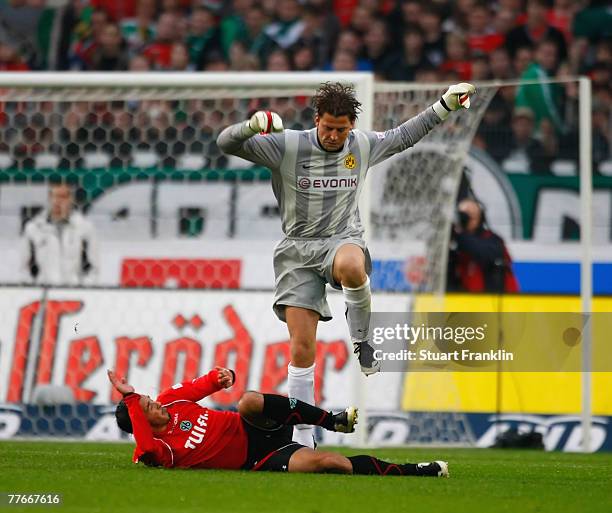 Roman Weidenfeller of Dortmund stopps a shot of Sergio Pinto - Da Silva of Hanover during the Bundesliga match between Hanover 96 and Borussia...