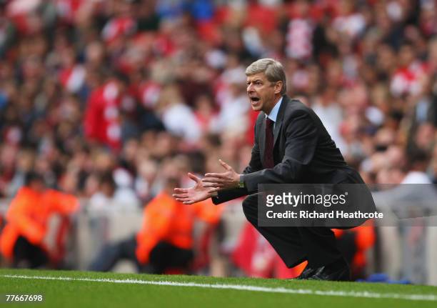 Arsene Wenger manager of Arsenal reacts during the Barclays Premier League match between Arsenal and Manchester United at the Emirates Stadium on...