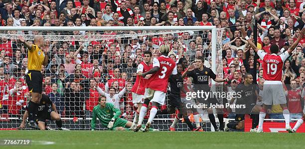 Gilberto of Arsenal celebrates after teammate William Gallas scored their second goal during the Barclays Premier League match between Arsenal and...