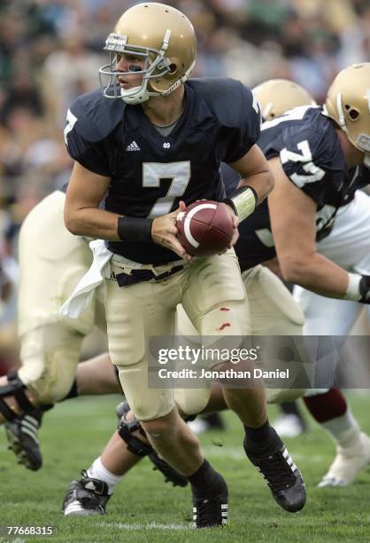 Jimmy Clausen of the Notre Dame Fighting Irish moves back to hand off the ball during the game against the Boston College Eagles on October 13, 2007...