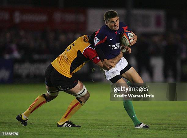 Toby Flood of Newcastle is tackled during the EDF Energy Cup match between Newcastle Falcons and Newport Gwent Dragons at Kington Park on November 3,...