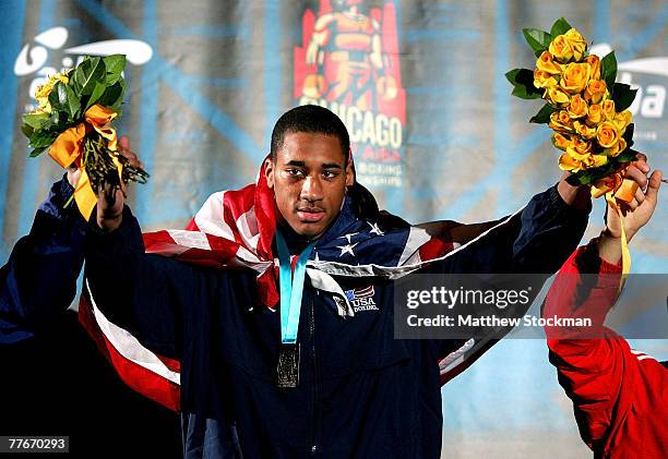 Demetrius Andrade stands on the victory podium after defeating Non Boonjumnong of Thailand to win the 69 kg division during the finals of the AIBA...