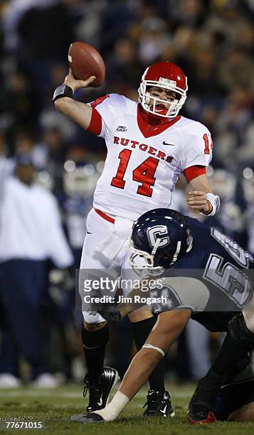 Alex Polito of the University of Connecticut Huskies presses quarterback Mike Teel of the Rutgers Scarlet Knights at Rentschler Field November 3,...