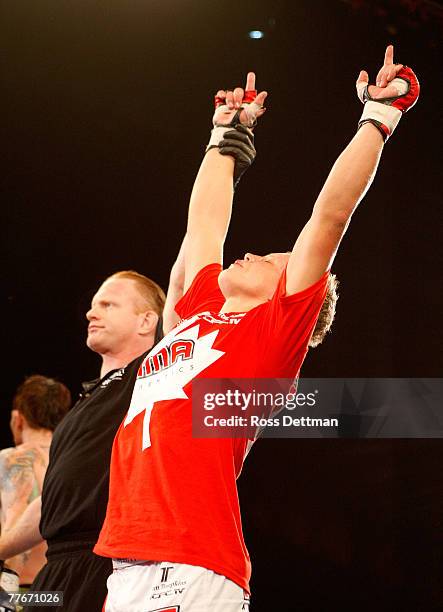 Chris Horodecki of the Anacondas celebrates his win by decision against Bart Palaszewski of the Silverbacks during their Lightweight bout at the...