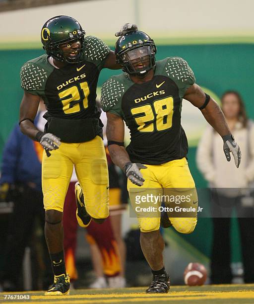 Running back Jonathan Stewart of the Oregon Ducks celebrates with Garren Strong after scoring a touchdown against the Arizona State Sun Devils at...