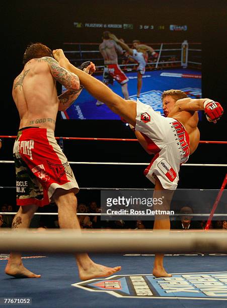 Chris Horodecki of the Anacondas lands a kick to the head against Bart Palaszewski of the Silverbacks during their Lightweight bout at the World...