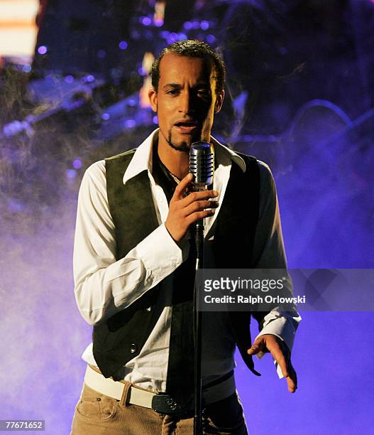 Singer Mark Medlock performs during the live-broadcast of the tv show "Das Supertalent" November 3, 2007 in Cologne, Germany.