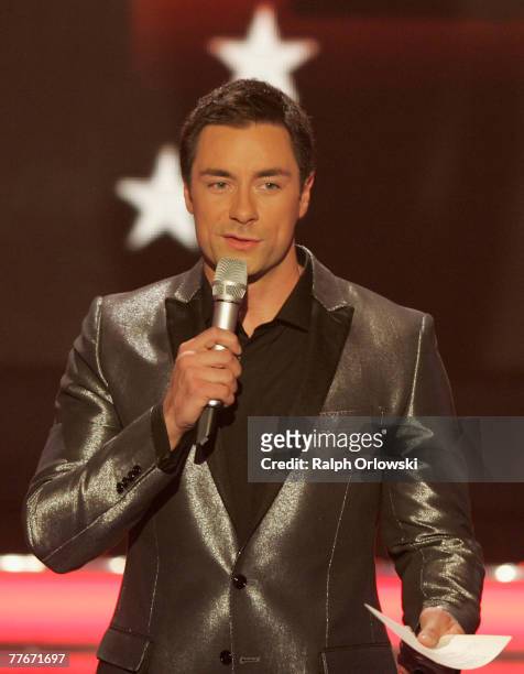 Tv host Marco Schreyl speaks during the live-broadcast of his tv show "Das Supertalent" November 3, 2007 in Cologne, Germany.