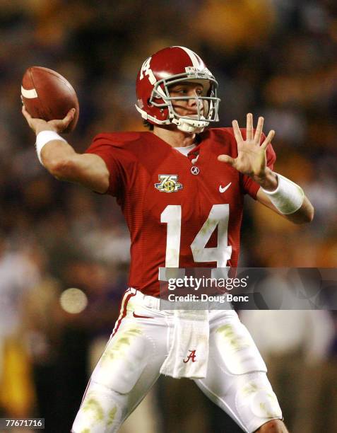 John Parker Wilson of the Alabama Crimson Tide throws a touchdown pass against the LSU Tigers at Bryant-Denny Stadium on November 3, 2007 in...