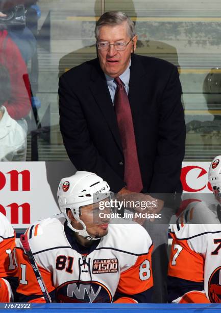 Head coach Al Arbour of the New York Islanders stands behind the bench as he coaches his 1,500th game for the islanders of the Pittsburgh Penguins on...