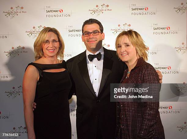 Safeway President of Marketing Mike Minasi and escort Rebecca Collison pose for a photo with Melissa Etheridge during the Safeway Foundation Gala...