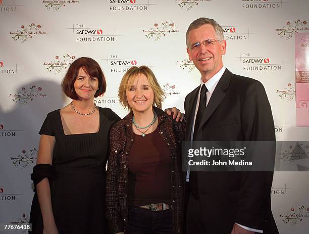 Safeway VP Brian Dowling and wife Pat pose for a photo with Melissa Etheridge during the Safeway Foundation Gala 'Nuture the Seeds of Hope' on...