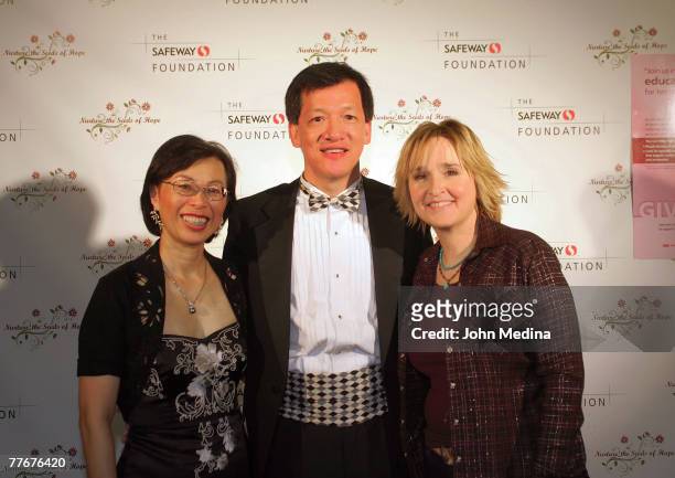 Safeway Executive VP David Ching and wife Alice and pose for a photo with Melissa Etheridge during the Safeway Foundation Gala 'Nuture the Seeds of...