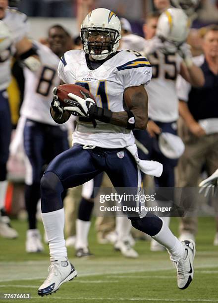 Antonio Cromartie of the San Diego Chargers goes 109 yards on a failed field goal attempt by Ryan Longwell of the Minnesota Vikings for a touchdown...