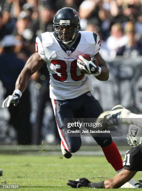 Ahman Green of the Houston Texans runs with the ball against the Oakland Raiders at McAfee Coliseum November 4, 2007 in Oakland, California.