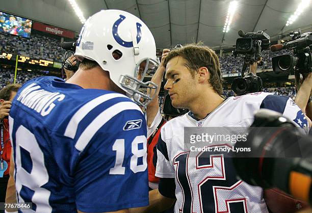 Peyton Manning of the Indianapolis Colts and Tom Brady of the New England Patriots meets on the field after the Patriots won their game 24-20 on...