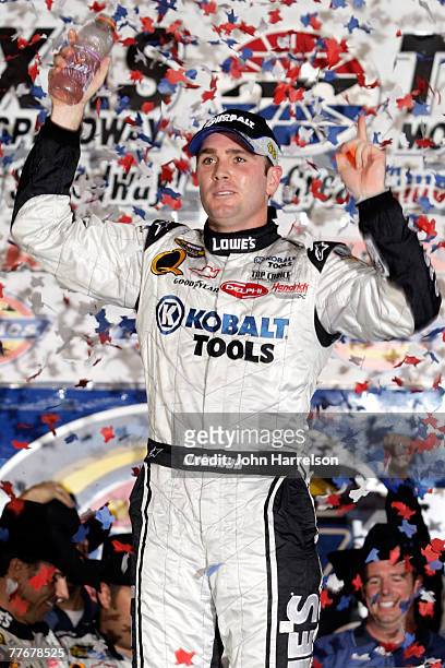 Jimmie Johnson, driver of the Lowe's/Kobalt Chevrolet, celebrates in victory lane after winning the NASCAR Nextel Cup Series Dickies 500 at Texas...