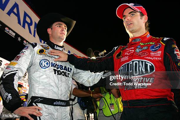 Jeff Gordon , driver of the DuPont Chevrolet, congratulates teammate Jimmie Johnson, driver of the Lowe's/Kobalt Chevrolet, after winning the NASCAR...