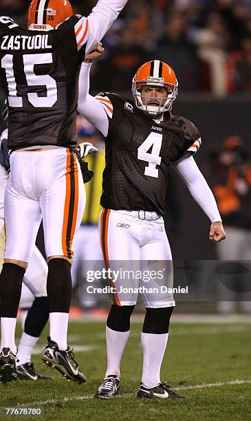 Phil Dawson of the Cleveland Browns celebrates his game-winning field goal in overtime with teammate Dave Zastudil against the Seattle Seahawks on...