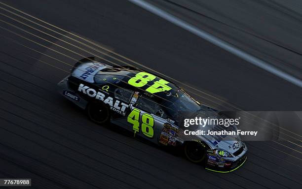 Jimmie Johnson, driver of the Lowe's/Kobalt Chevrolet, races during the NASCAR Nextel Cup Series Dickies 500 at Texas Motor Speedway on November 4,...