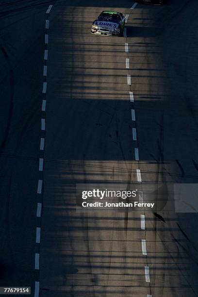 Jimmie Johnson, driver of the Lowe's/Kobalt Chevrolet, races during the NASCAR Nextel Cup Series Dickies 500 at Texas Motor Speedway on November 4,...