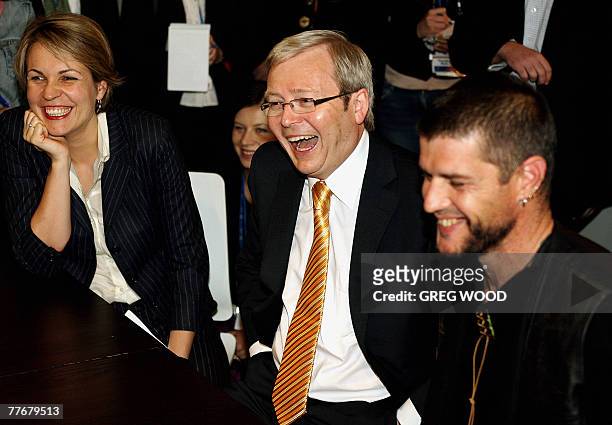 Australian Opposition Leader Kevin Rudd , with Shadow Minister for Housing Tanya Plibersek , and Mission Australia Centre client Anthony , laughs...
