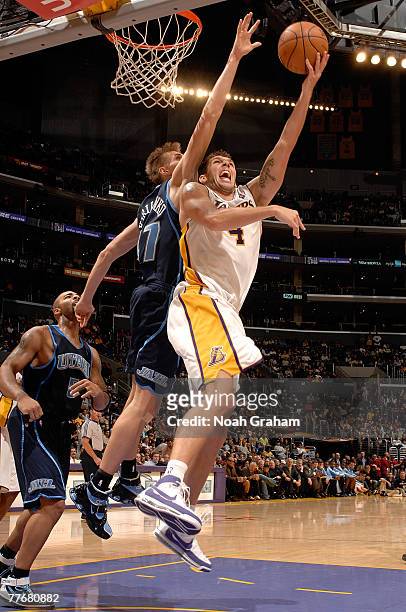 Luke Walton of the Los Angeles Lakers goes to the basket against Andrei Kirilenko of the Utah Jazz at Staples Center on November 4, 2007 in Los...