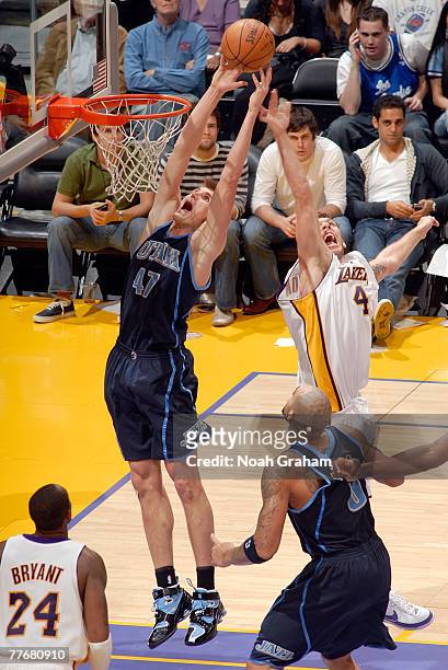 Andrei Kirilenko of the Utah Jazz battles for the rebound against Luke Walton of the Los Angeles Lakers at Staples Center on November 4, 2007 in Los...