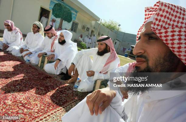 Young Saudi men released from the US Guantanamo Bay detention-centre as well as prisons in Iraq and Saudi Arabia listen to a Muslim cleric during a...