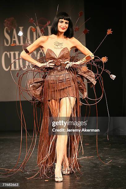 Spanish model Irene Salvador displays a chocolate decorated dress created by fashion designer Nelly Biche de Bere and chocolate maker Chocolat Weiss,...