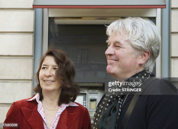 French writer Gilles Leroy and book publisher Isabelle Gallimard pose, 05 November 2007 in Paris after Leroy received the 2007 French literature...