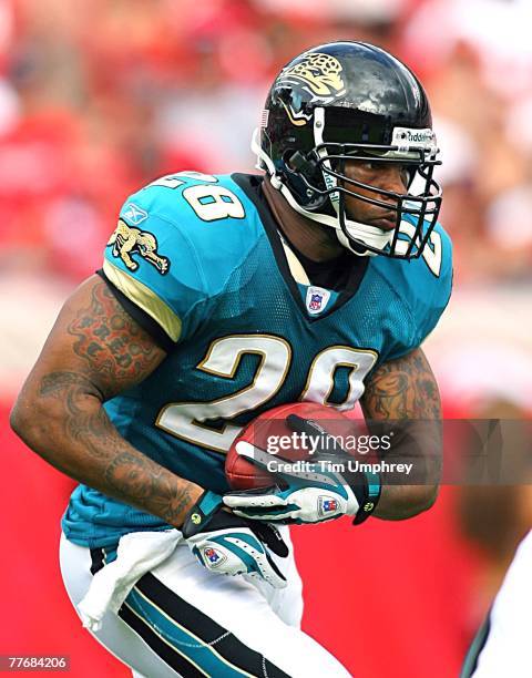 Running back Fred Taylor of the Jacksonville Jaguars runs down field in a game against the Tampa Bay Buccaneers at Raymond James Stadium on October...