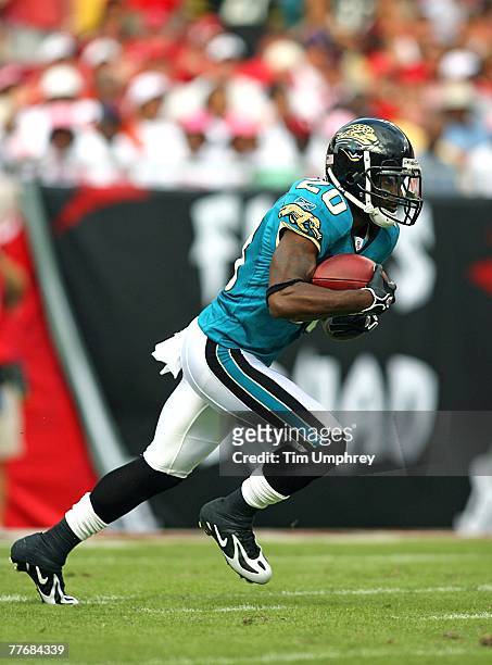 Cornerback Scott Starks of the Jacksonville Jaguars runs down field in a game against the Tampa Bay Buccaneers at Raymond James Stadium on October...