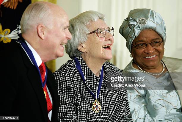 Pulitzer Prize winner and author of "To Kill A Mockingbird" Harper Lee smiles with C-SPAN President and CEO Brian Lamb and Liberia president Ellen...