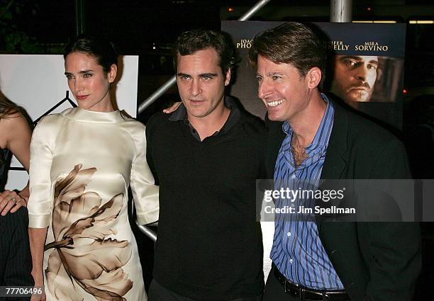 Actors Jennifer Connelly and Joaquin Phoenix and Author John Burnham Schwartz arrive at the "Reservation Road" Premiere at the United Artists'...