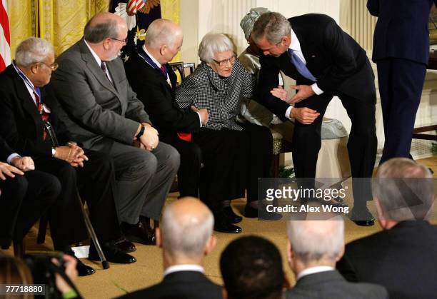 President George W. Bush helps Pulitzer Prize winner and author of "To Kill A Mockingbird" Harper Lee to get up as C-SPAN President and CEO Brian...