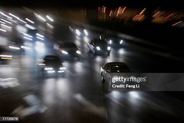 Vehicles drive on the highway that passes Beijing Olympic National stadium on November 5, 2007 In Beijing, China. The 2008 Olympics host city will...
