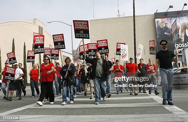 Striking writers picket outside Warner Brothers Studios after contract talks between the Writers Guild of America and the Alliance of Motion Picture...