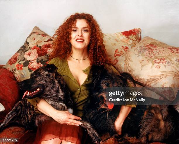 Bernadette Peters poses with her dogs during the winter of 1995 at her apartment in New York City. Peters, an award winning singer and actress has...