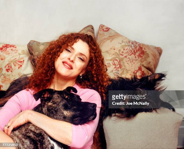 Bernadette Peters poses with her dogs during the winter of 1995 at her apartment in New York City. Peters, an award winning singer and actress has...