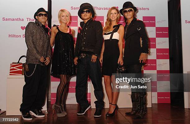 Paris Hilton, Nicky Hilton and DJ Ozma pose at a presscall for Samantha Thavasa at Club XROSS on November 5, 2007 in Tokyo, Japan.