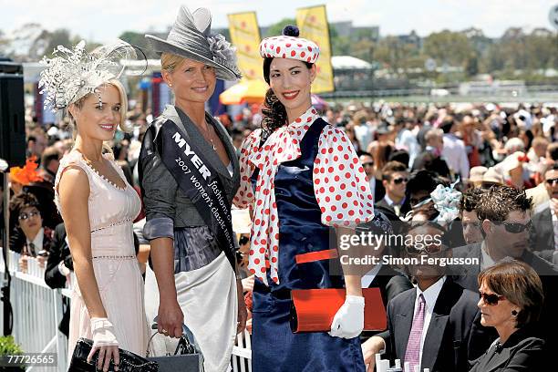 Winners of the Fashion on the Field best dressed, Margot Carle, Lorraine Cookson and Lisa Tan pose during the second day of the Melbourne Cup...