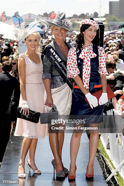 Winners of the Fashion on the Field best dressed, Margot Carle, Lorraine Cookson and Lisa Tan pose during the second day of the Melbourne Cup...