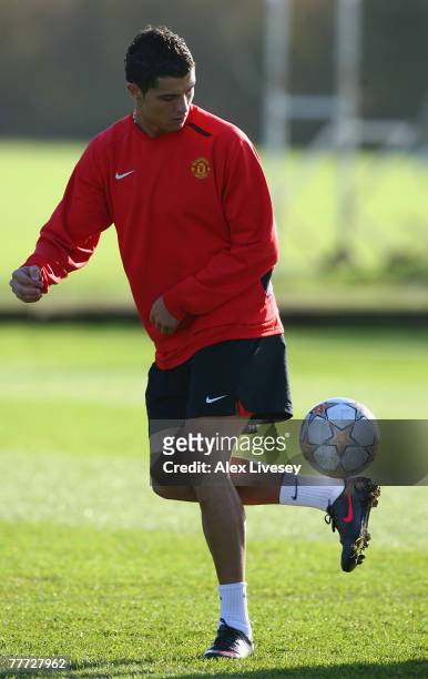 Cristiano Ronaldo of Manchester United juggles the ball during the Manchester United training session held at the Carrington Training complex on...