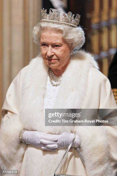 Queen Elizabeth II wears the Diamond Diadem made by Rundell, Bridge & Rundell as she arrives at the House of Lords for the State Opening of...