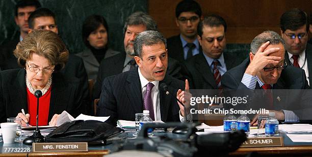 Senate Judiciary Committee member Sen. Russell Feingold delivers his opening remarks as fellow members Sen. Dianne Feinstein and Sen. Charles Schumer...