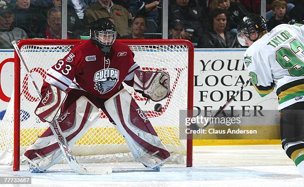 Justin Taylor of the London Knights fires a shot at Thomas McCollum of the Guelph Storm in a game on November 4, 2007 at the John Labatt Centre in...