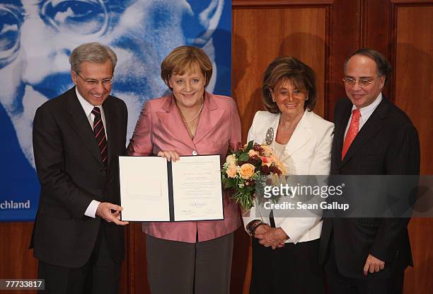 German Chancellor Angela Merkel poses with head of the Central Council of Jews in Germany Charlotte Knobloch , Vice President Salomon Korn and...