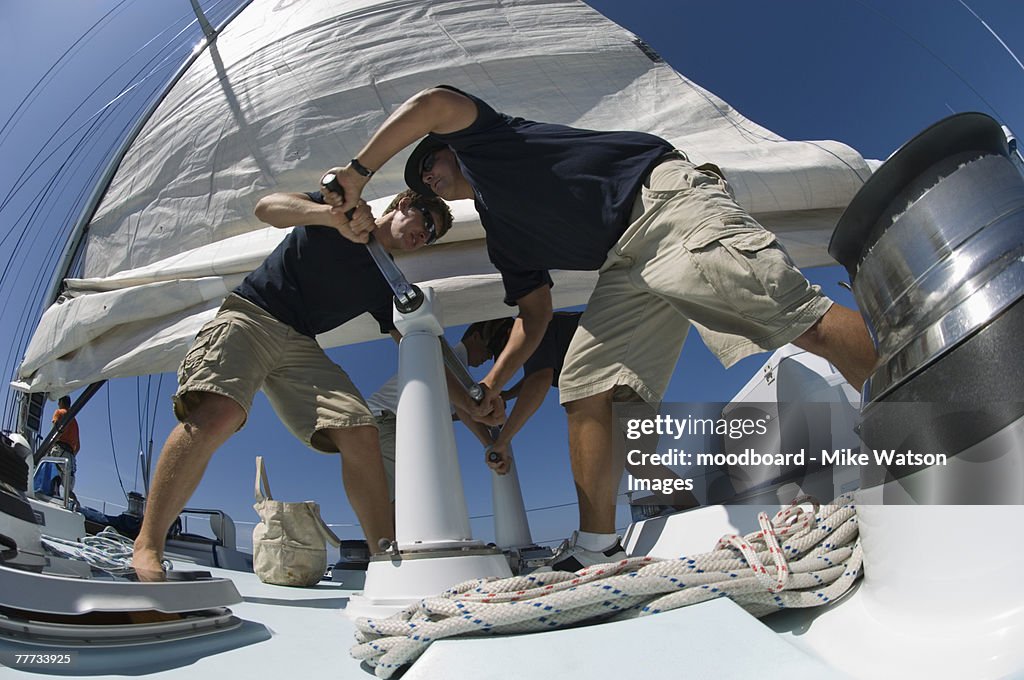 Sailors During Yacht Race Raising Sail